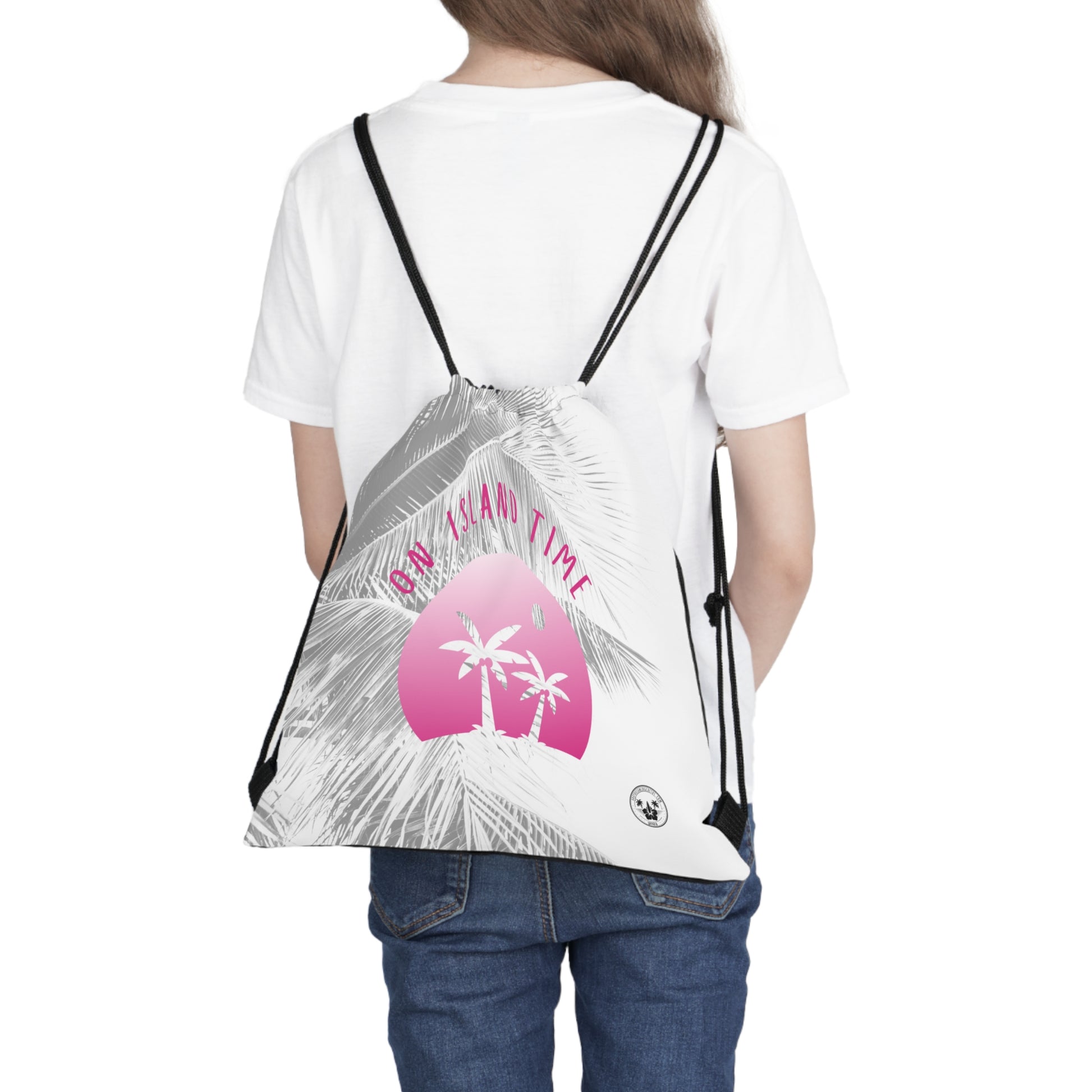 A Daydreaming Cactus created the ultimate travel companion drawstring backpack combines functionality with style, featuring a vibrant gradient pink simple graphic of two palmtrees on an island  and grey tone palm tree background with the text "On Island Time" design. Perfect for on-the-go adventurers, this lightweight backpack is ideal for storing essentials while exploring. Grab yours now for an unforgettable journey! This image is front view of the backpack on the back of a model.