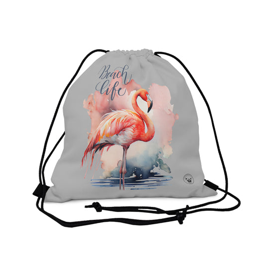Unleash your wanderlust with our versatile drawstring backpack! Embrace travel with ease and style, flaunting a Beach Life Flamingo graphic with bright color backgrounds. This one is a grey background. Designed for adventurers, it's the perfect blend of practicality and fashion. Get yours today for your next adventure! This is a front view of the backpack.