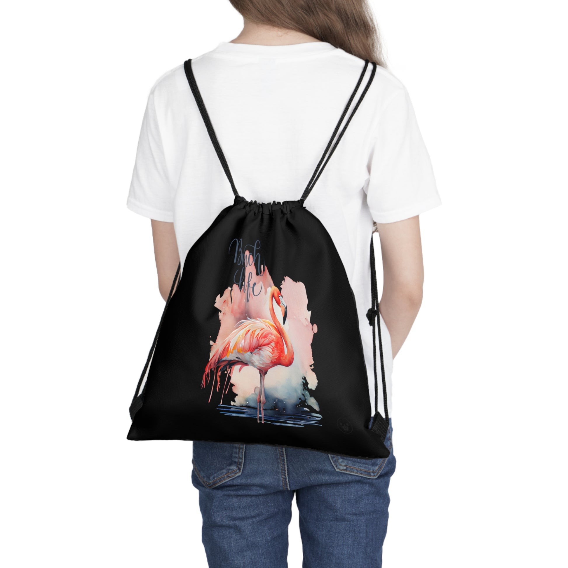 Unleash your wanderlust with our versatile drawstring backpack! Embrace travel with ease and style, flaunting a Beach Life Flamingo graphic with bright color backgrounds. This one is a black background. Designed for adventurers, it's the perfect blend of practicality and fashion. Get yours today for your next adventure! This is a front view of the backpack on the back of a model. 